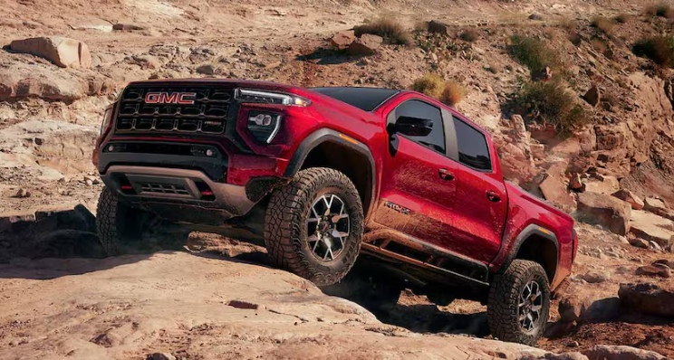 2026 GMC Canyon off-road pickup climbing rocky terrain